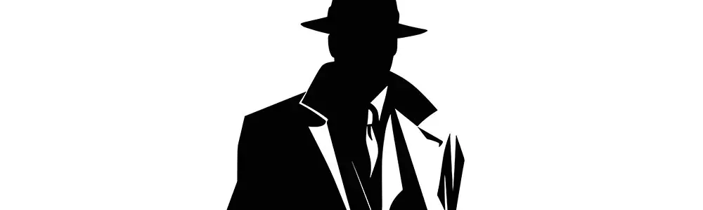 black and white silhouette of a gangster in a suit, overcoat and hat